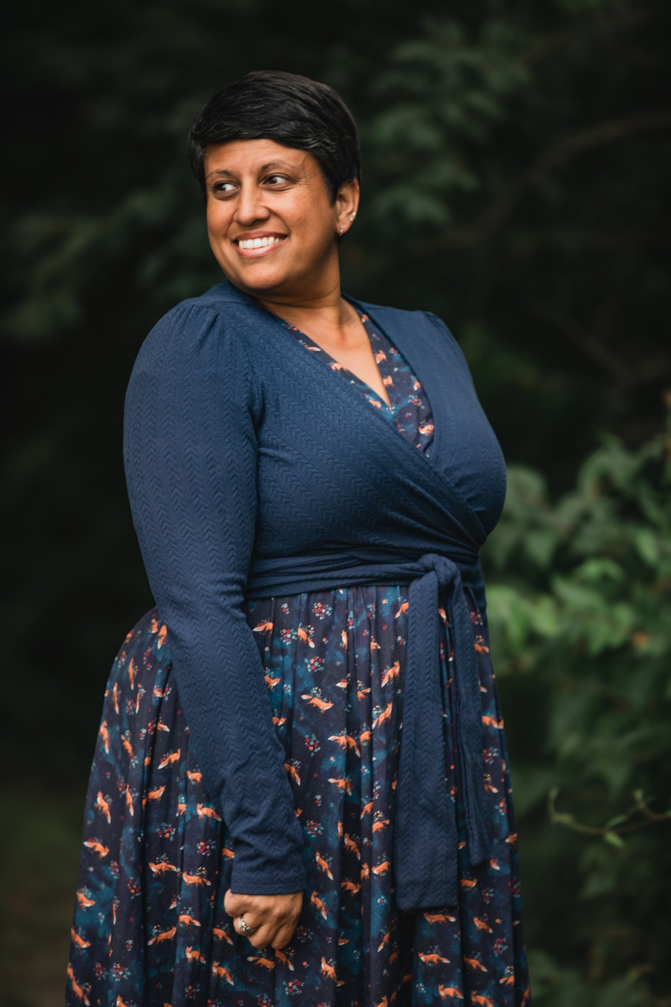 Woman in modest nursing-friendly blue floral patterned dress