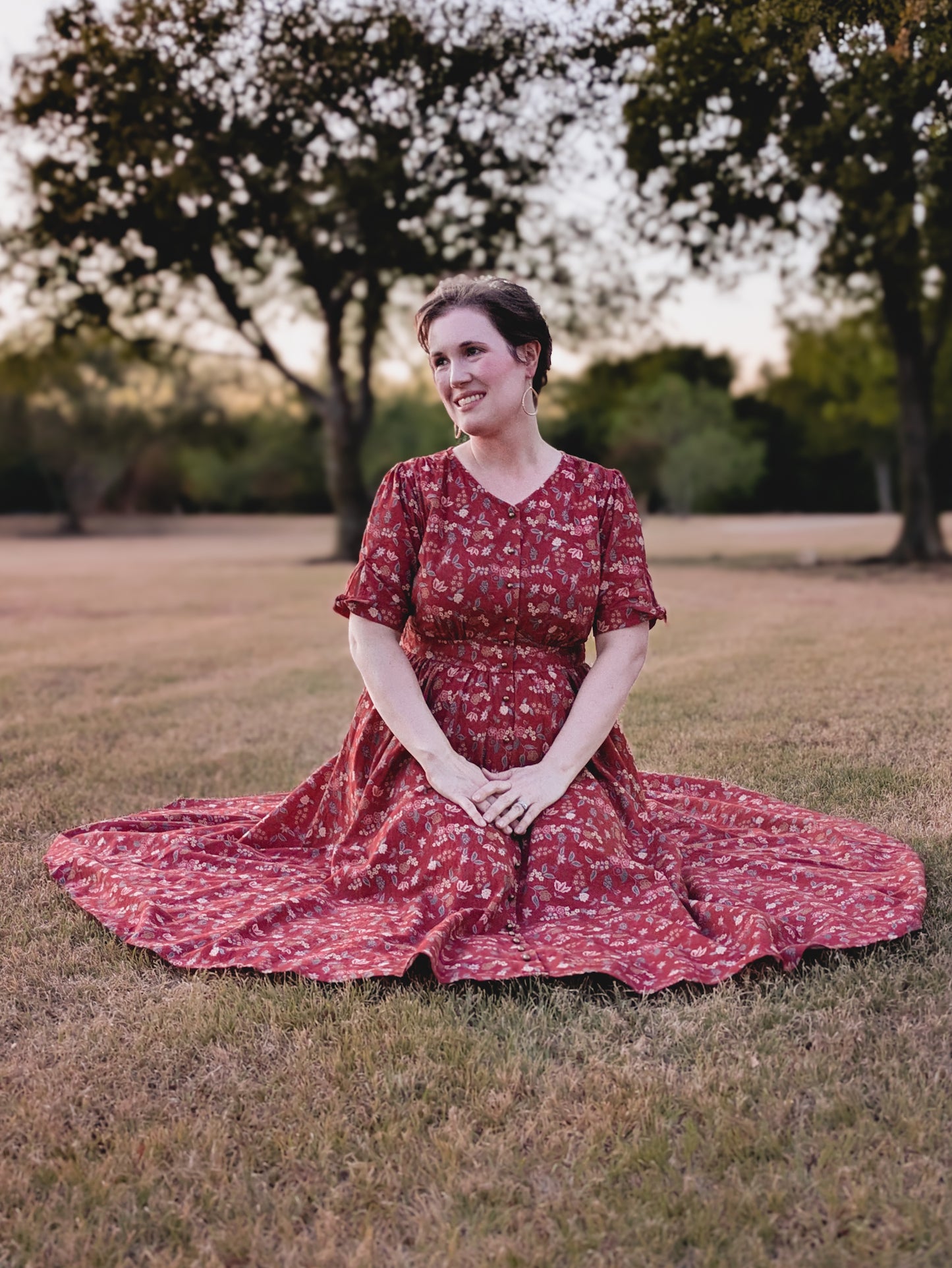 Woman in modest nursing red floral dress outdoors