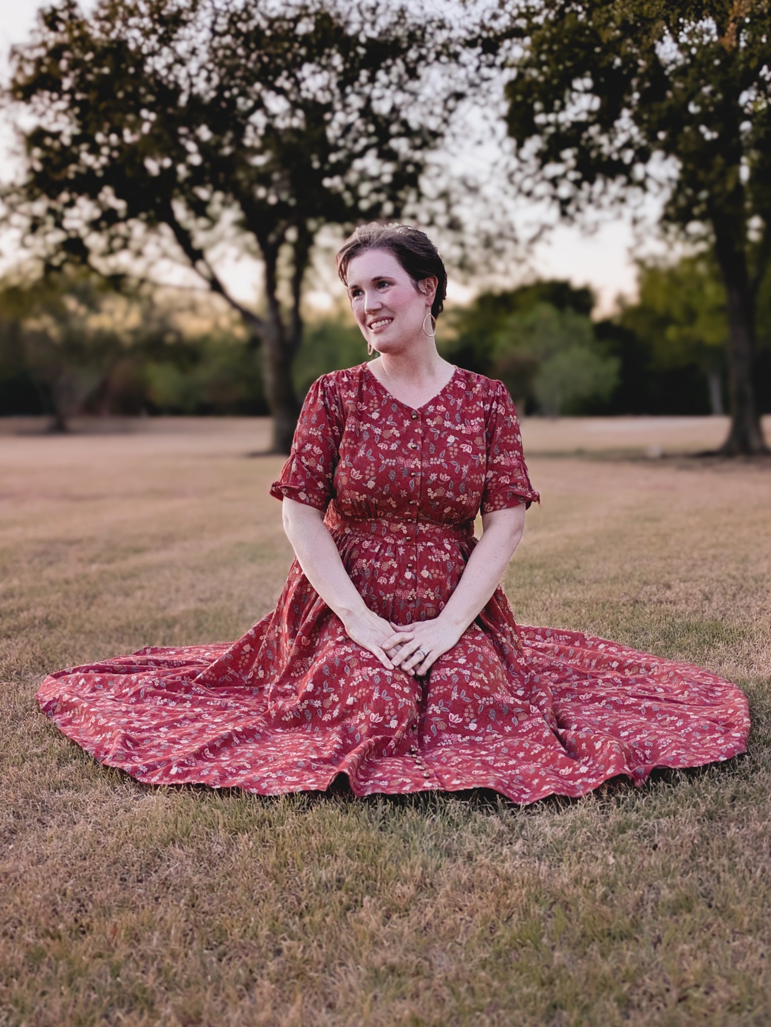 Woman in modest nursing red floral dress outdoors