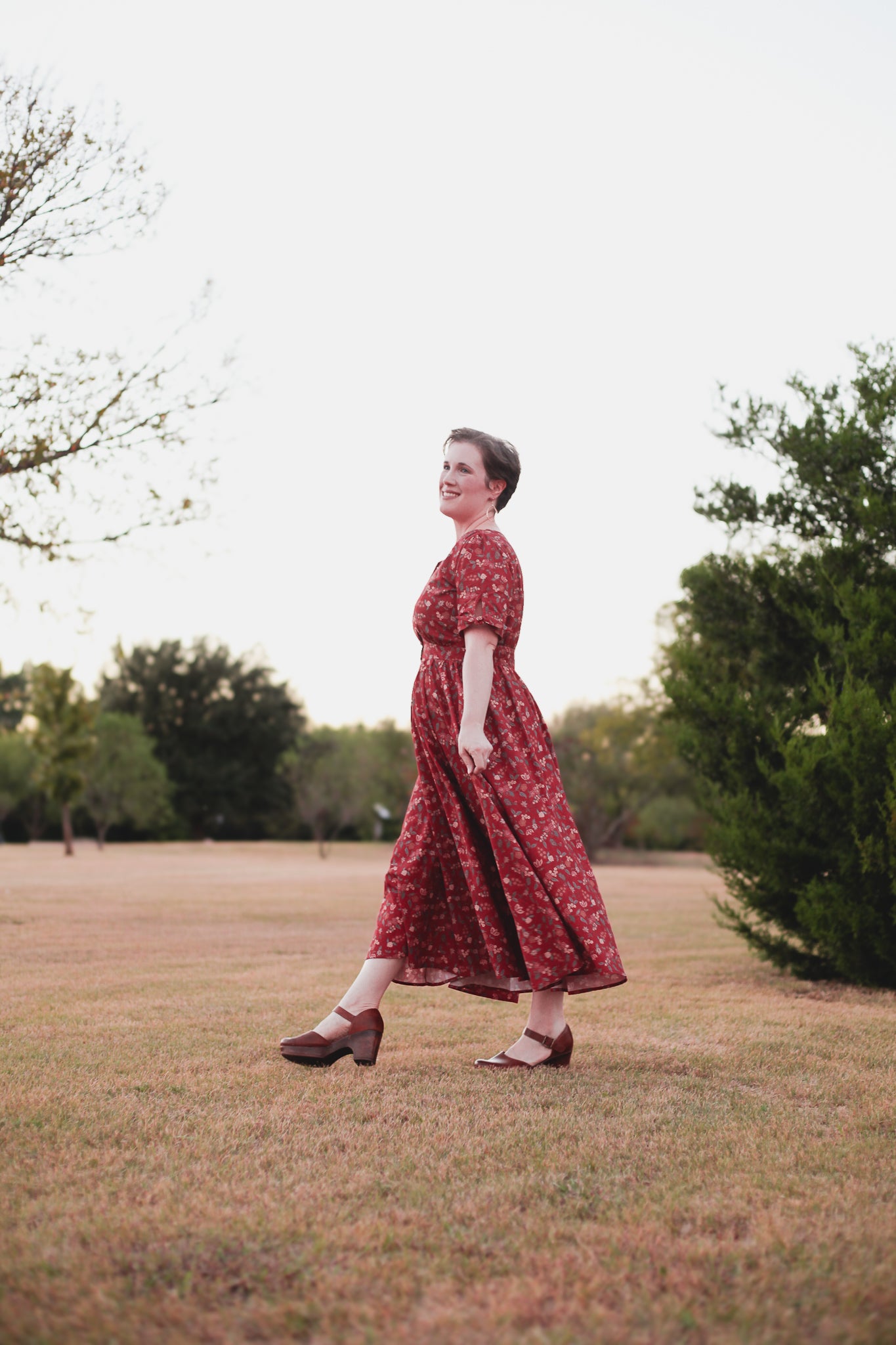 Woman in modest nursing red dress outdoors