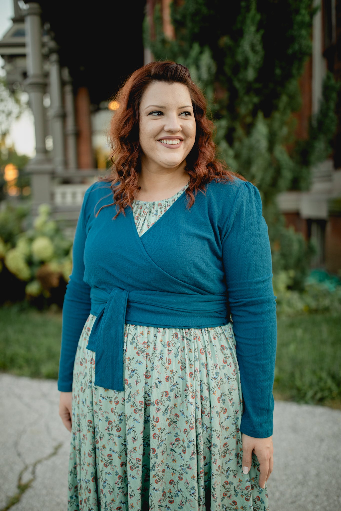 Woman in modest nursing floral dress with cardigan