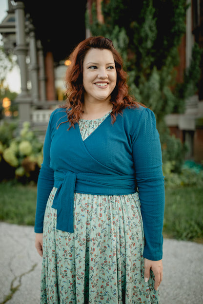 Woman in modest nursing floral dress with cardigan