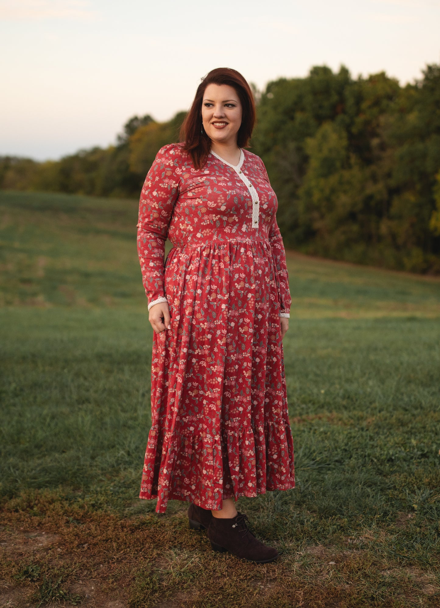 Woman in modest nursing red floral dress outdoors