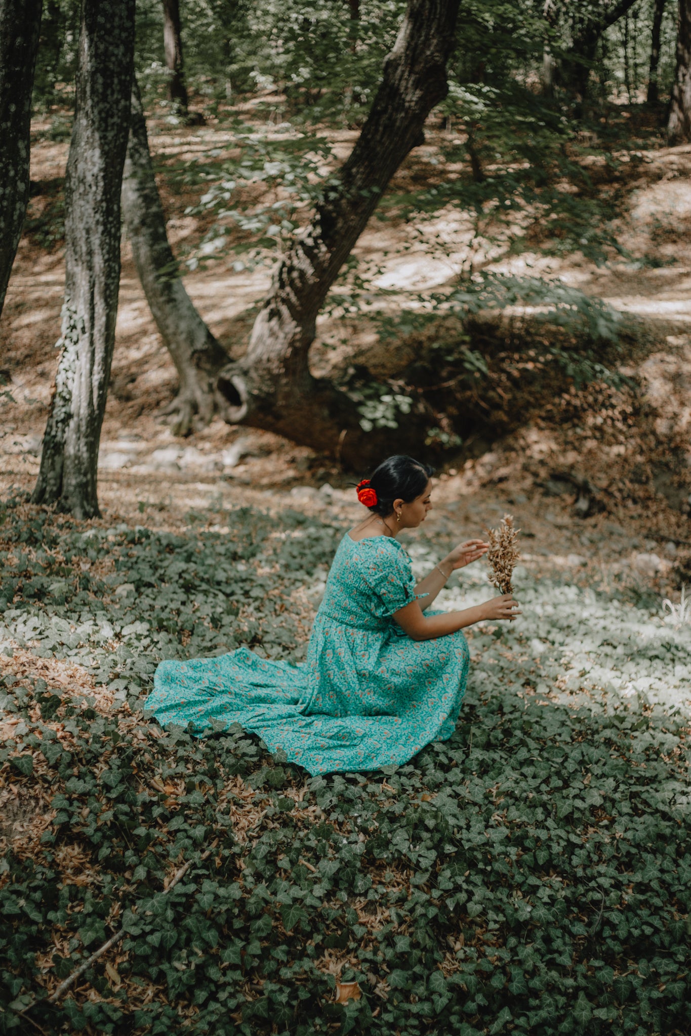 woman wearing a modest nursing green dress