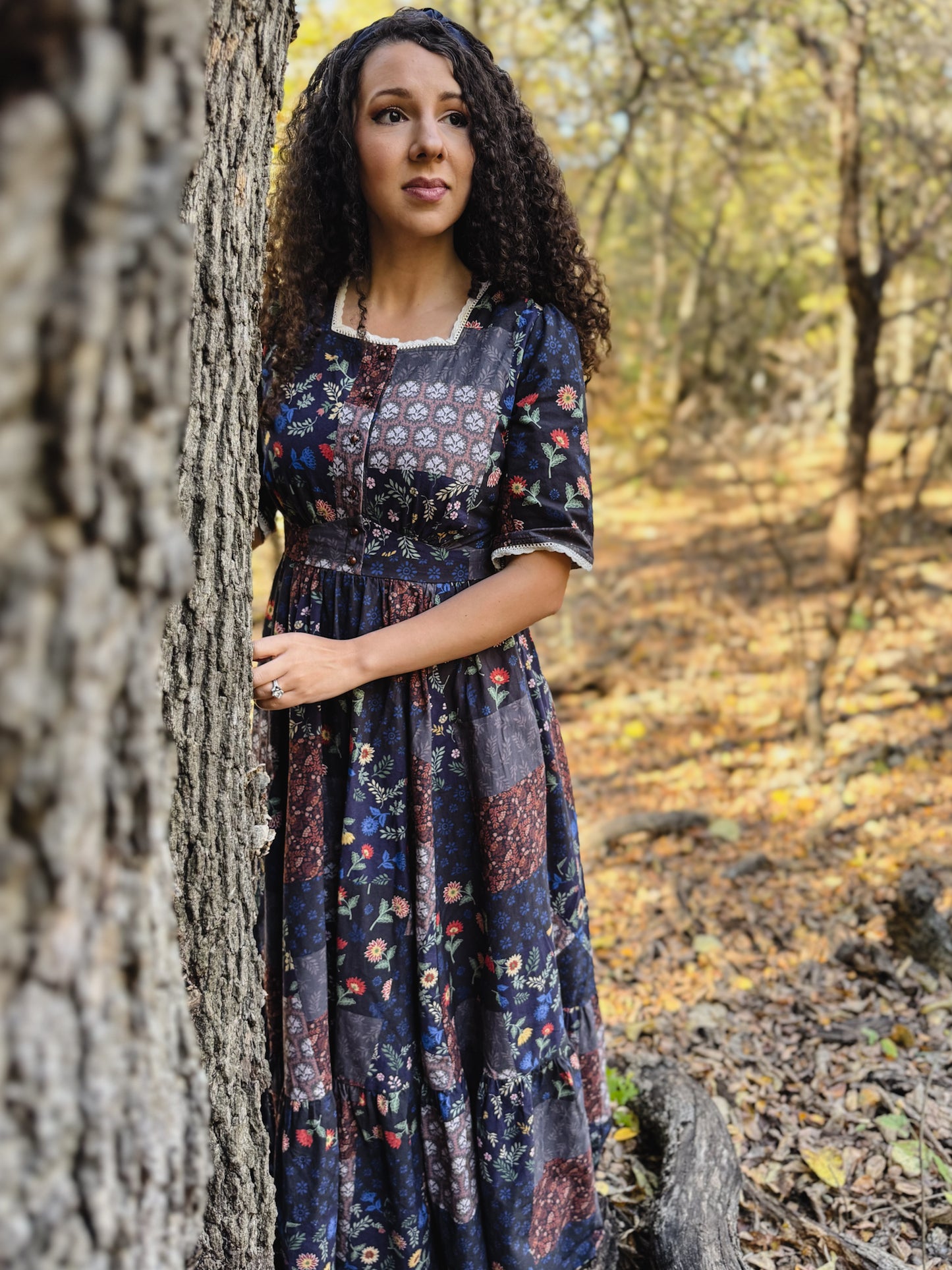 woman wearing a modest nursing patterned dress
