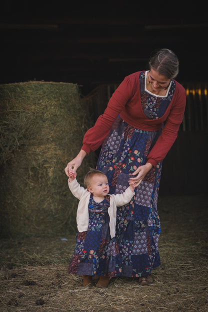 mother wearing a modest nursing patchwork dress with her daughter
