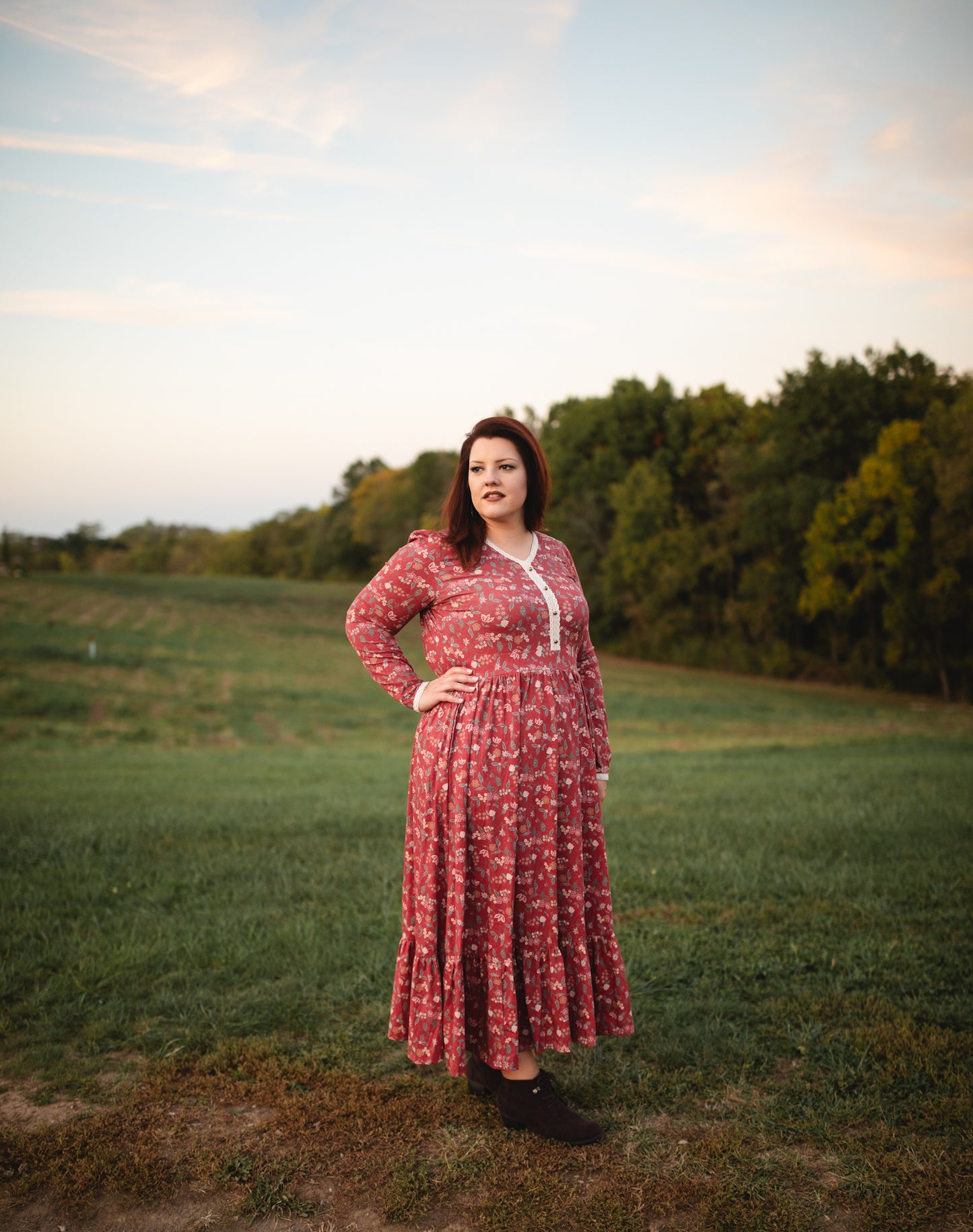 Woman in modest nursing red floral dress outdoors