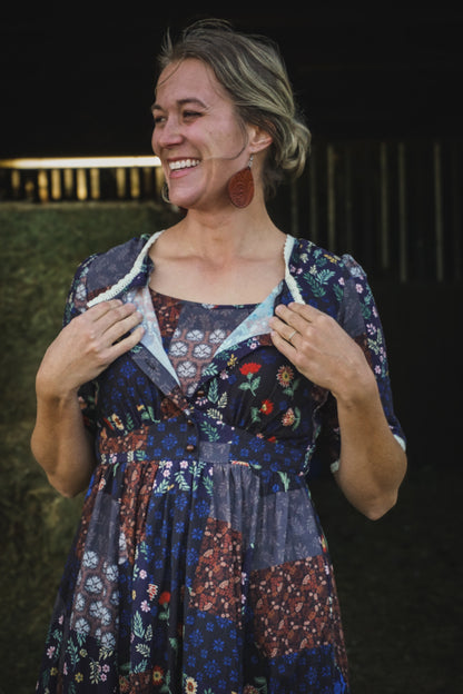 woman wearing a modest nursing patterned dress