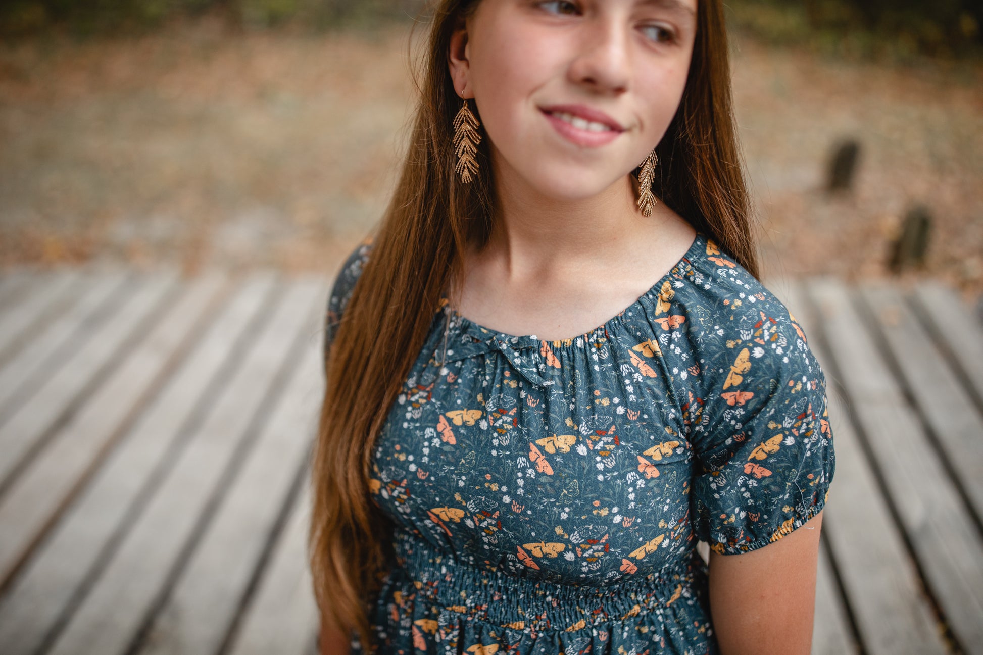 Girl in modest floral dress outdoors