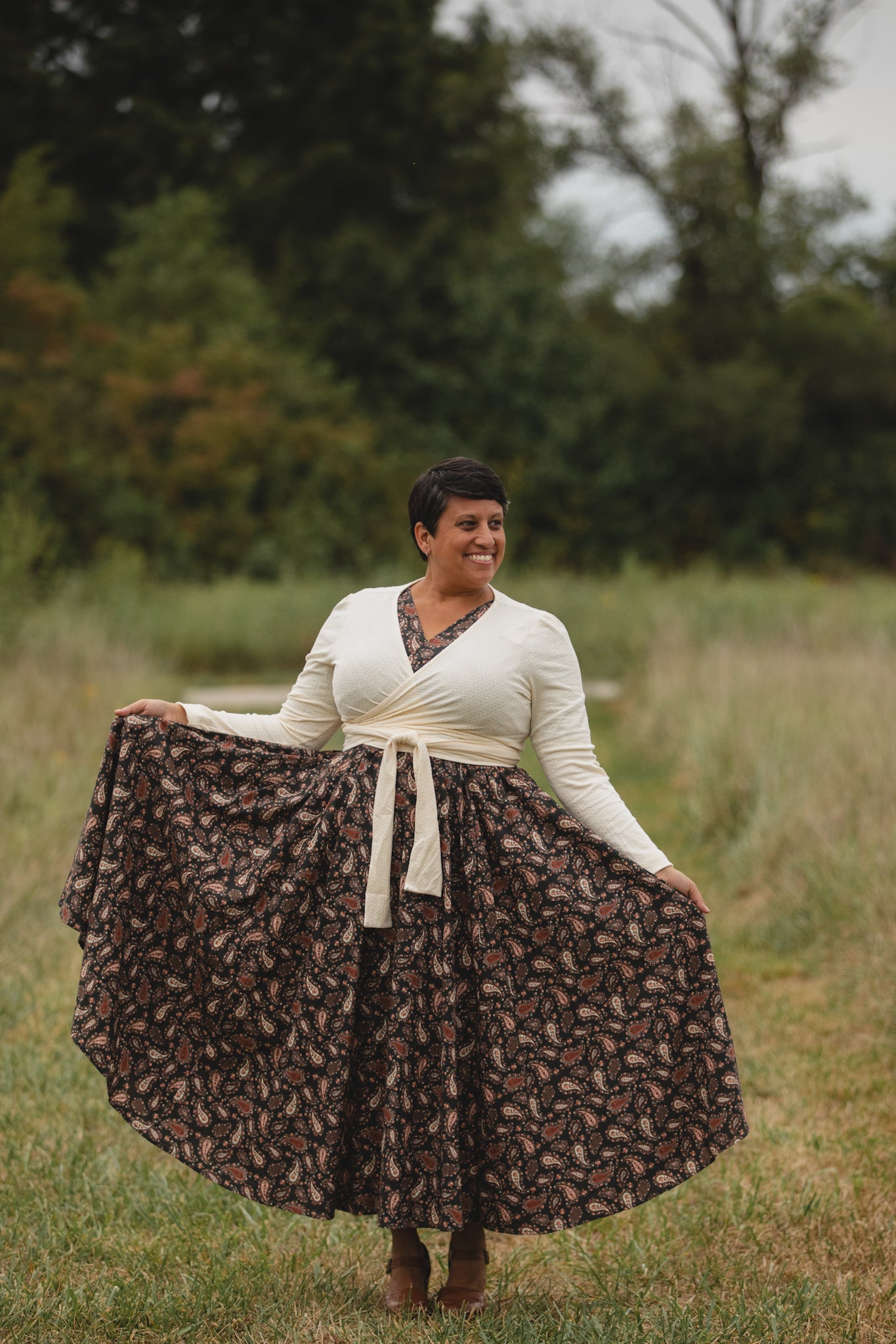 woman in a modest nursing dress in field