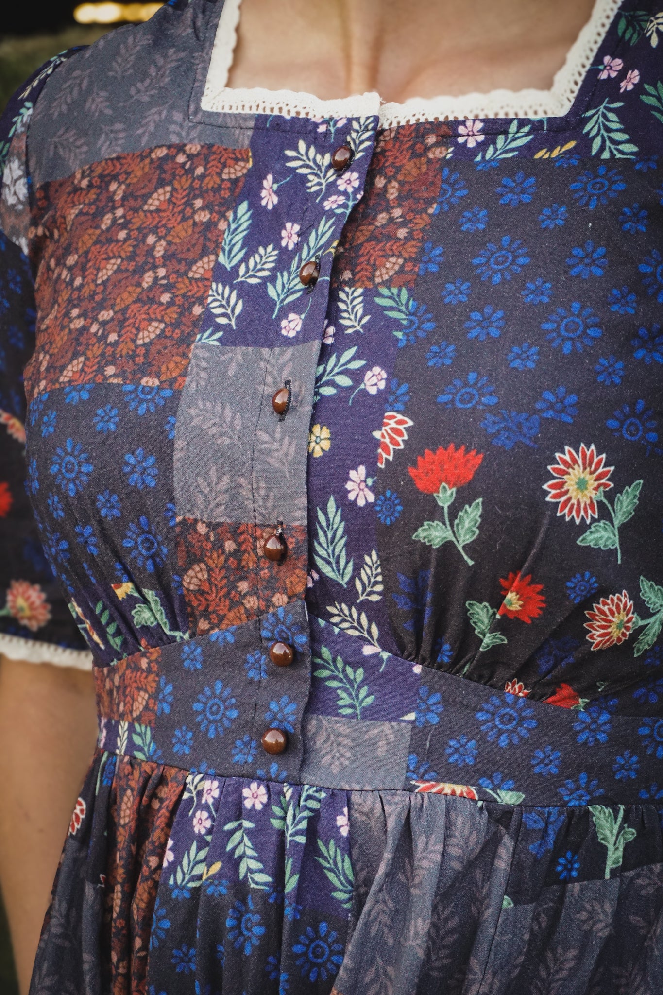 woman wearing a modest nursing patterned dress