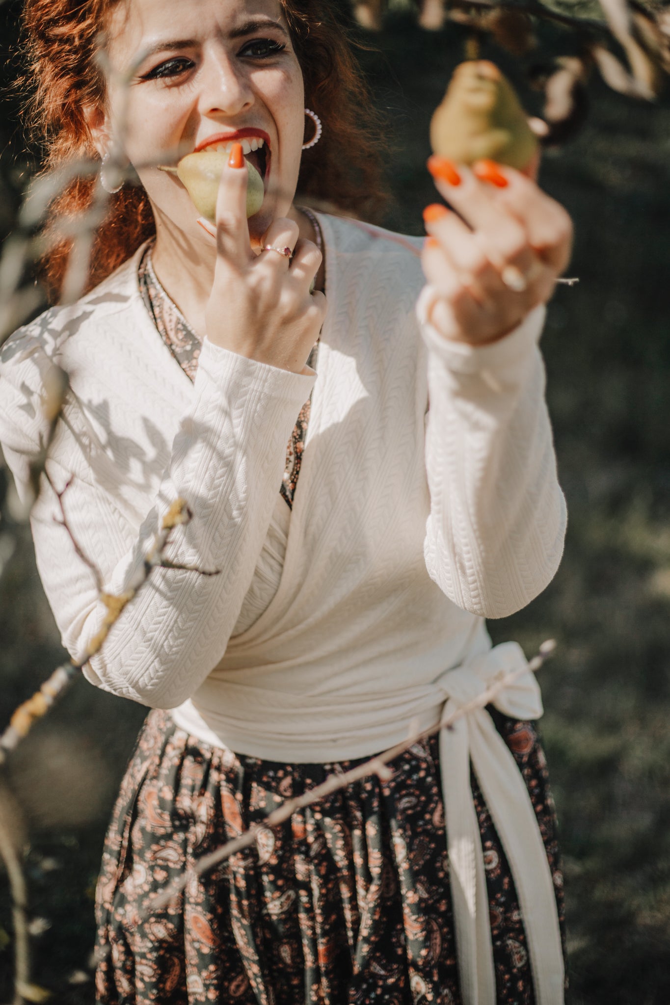 Woman in modest nursing dress holding bird outdoors
