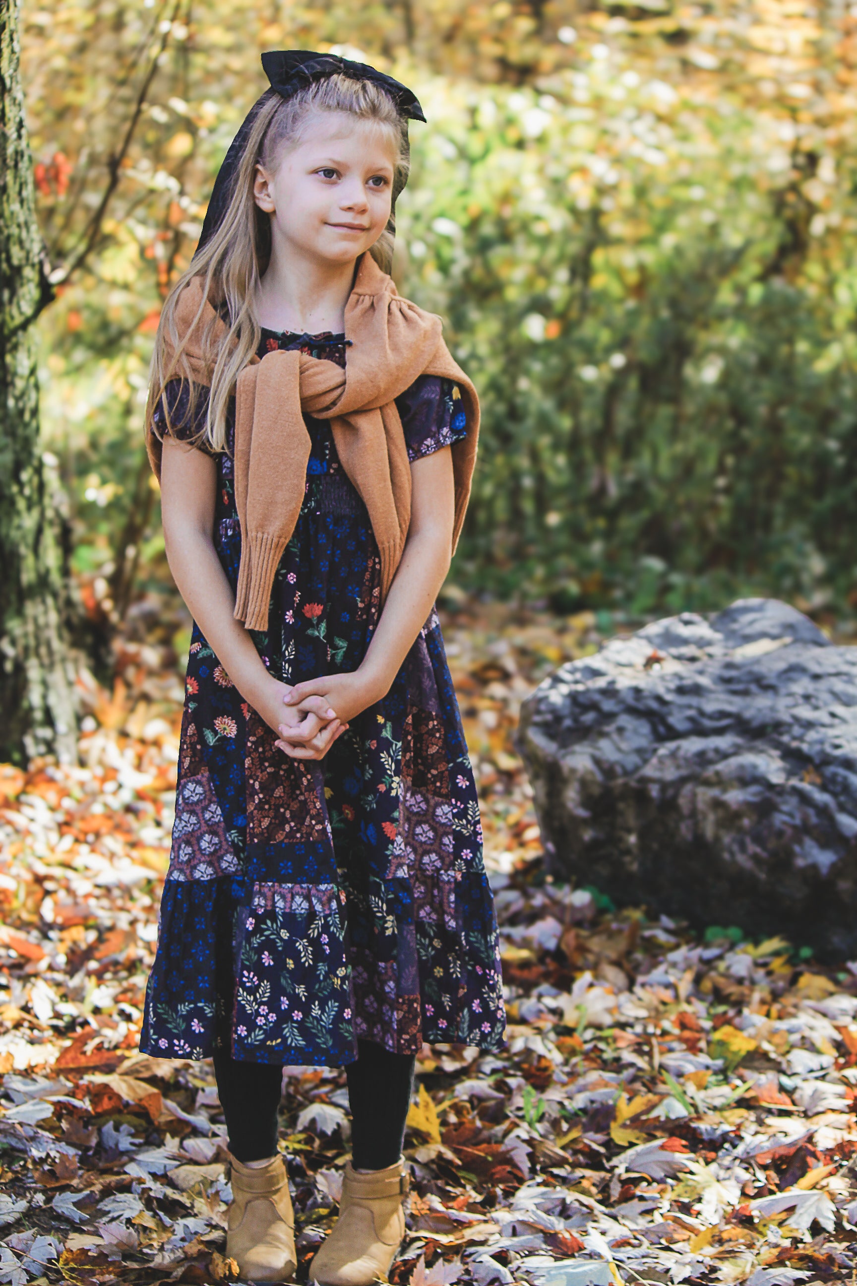 young girl wearing a cute patchwork dress