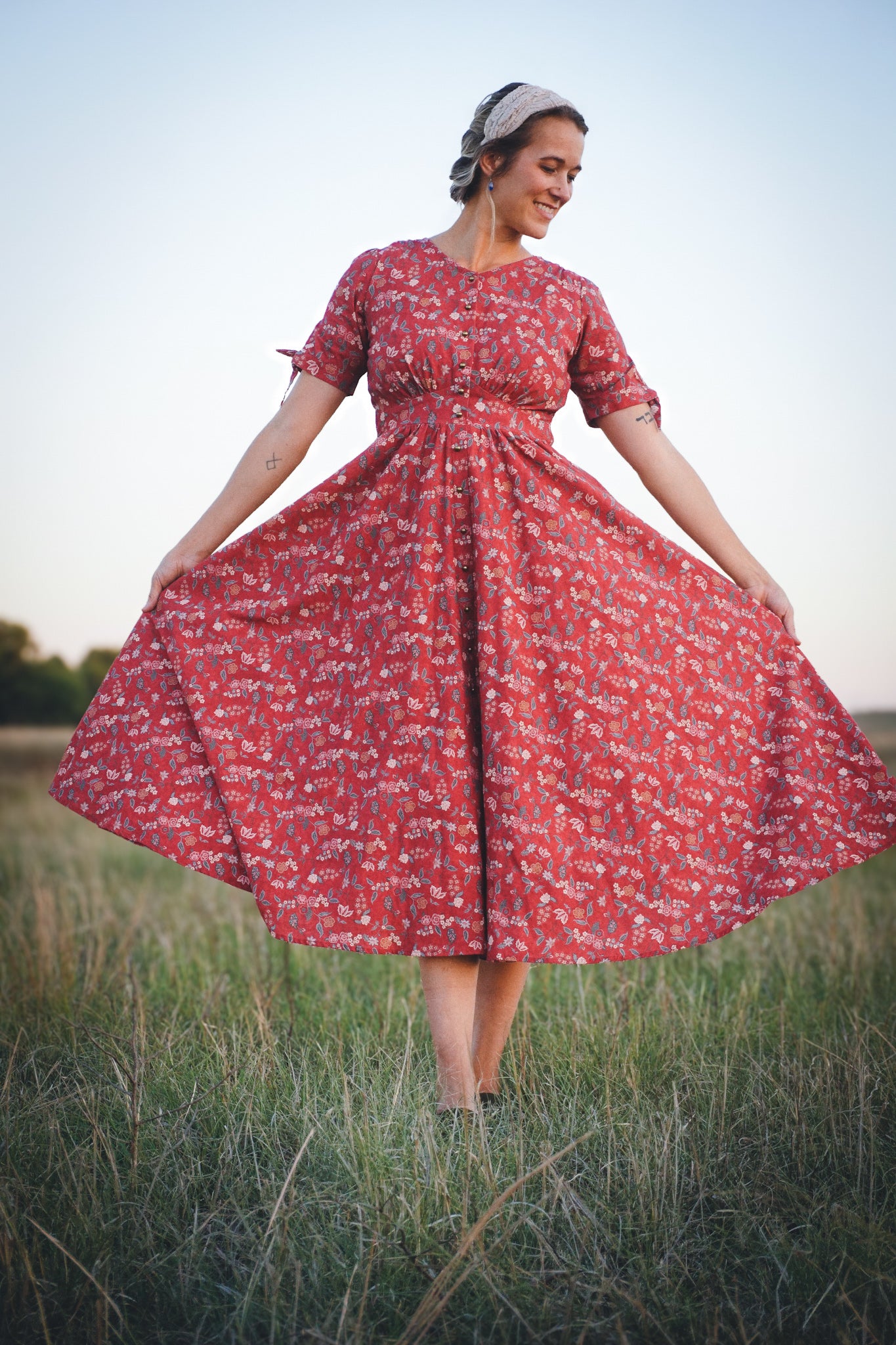 Woman in modest nursing red floral dress outdoors