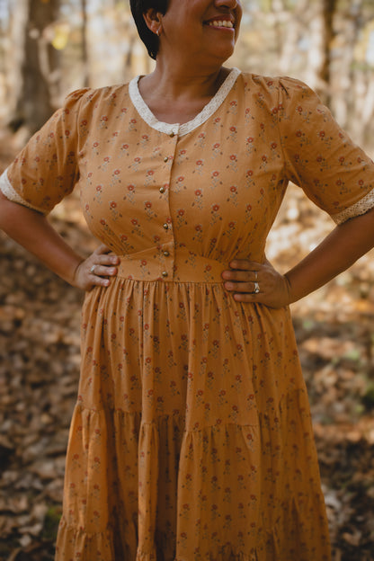 Woman in modest nursing dress yellow floral forest