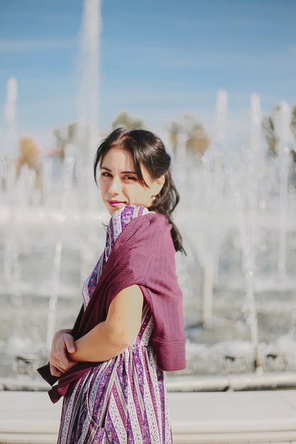 woman wearing a modest nursing purple and white striped dress