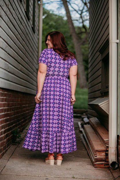 woman wearing patterned purple modest nursing dress