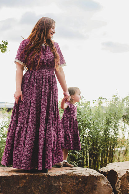 Two women wearing modest nursing dresses outdoors
