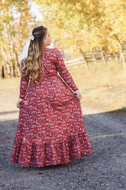 Woman in modest nursing red floral dress outdoors
