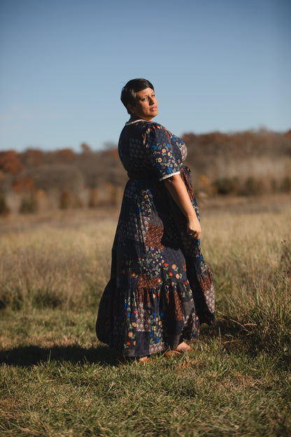 woman wearing a modest nursing patterned dress