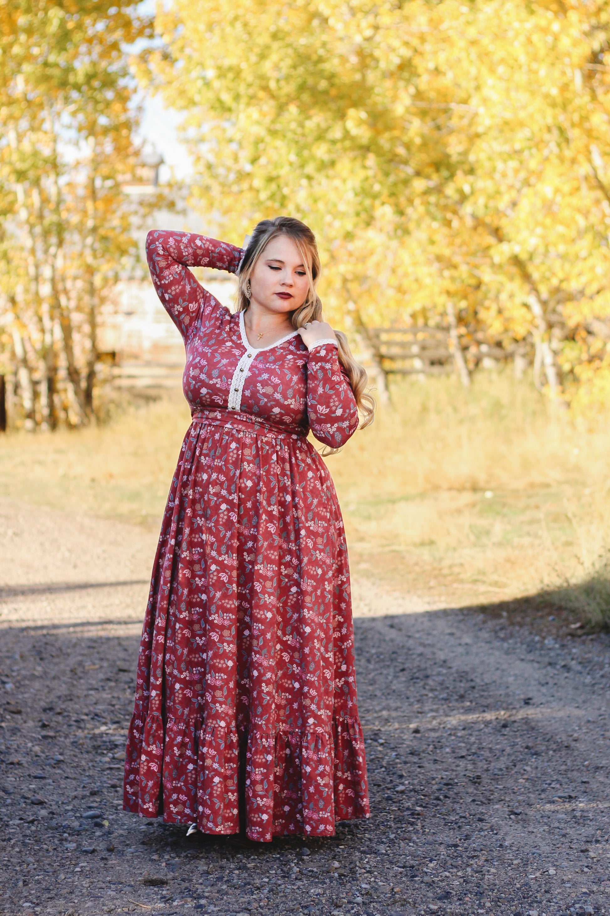 Woman in modest nursing red floral dress outdoors
