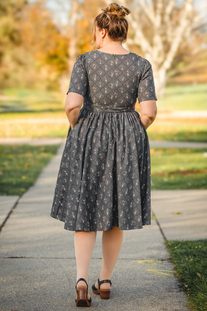 Modest nursing-friendly gray floral dress back view