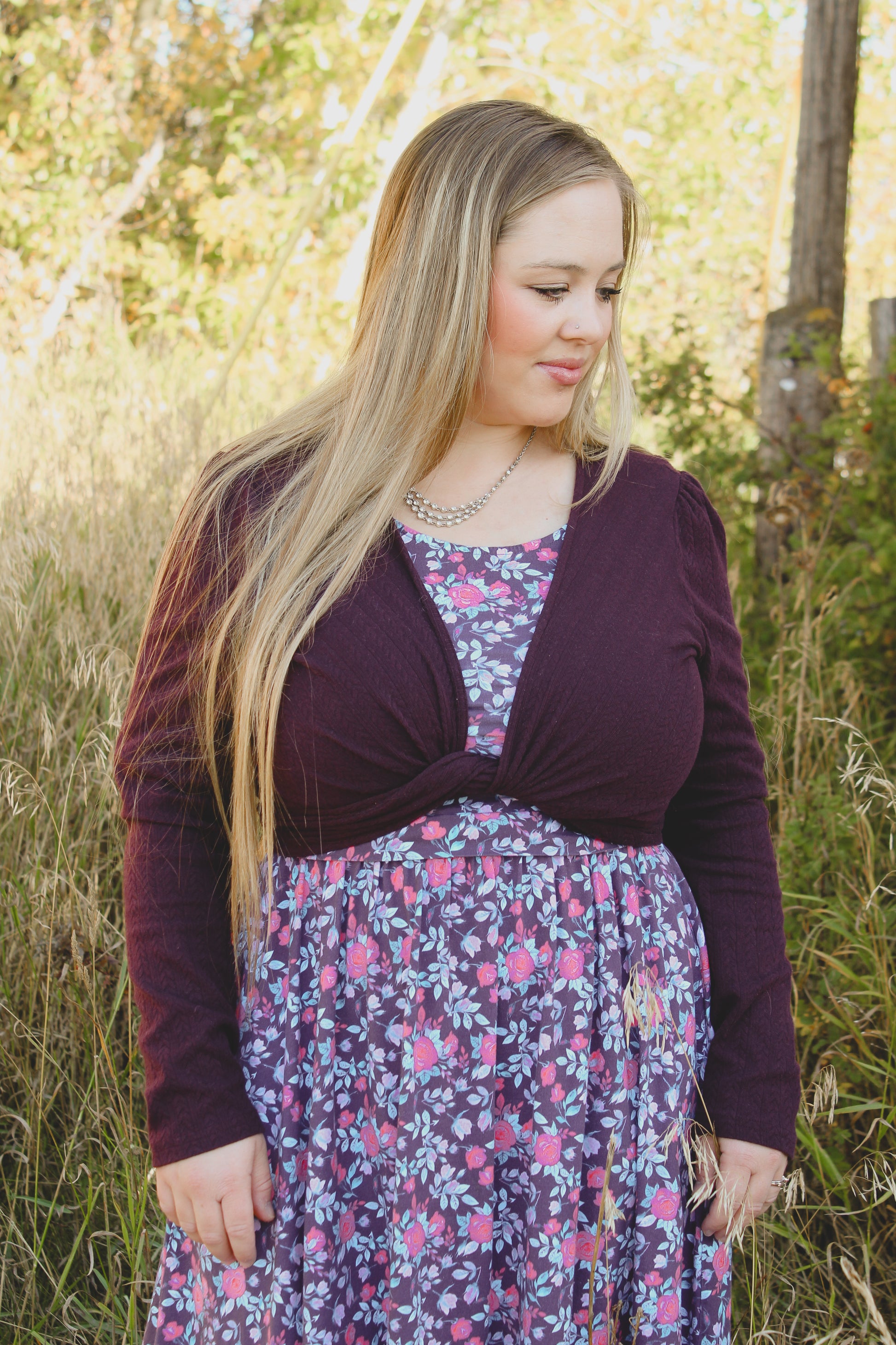Woman in modest nursing dress with cardigan outdoors