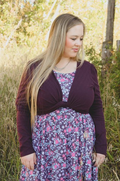 Woman in modest nursing dress with cardigan outdoors