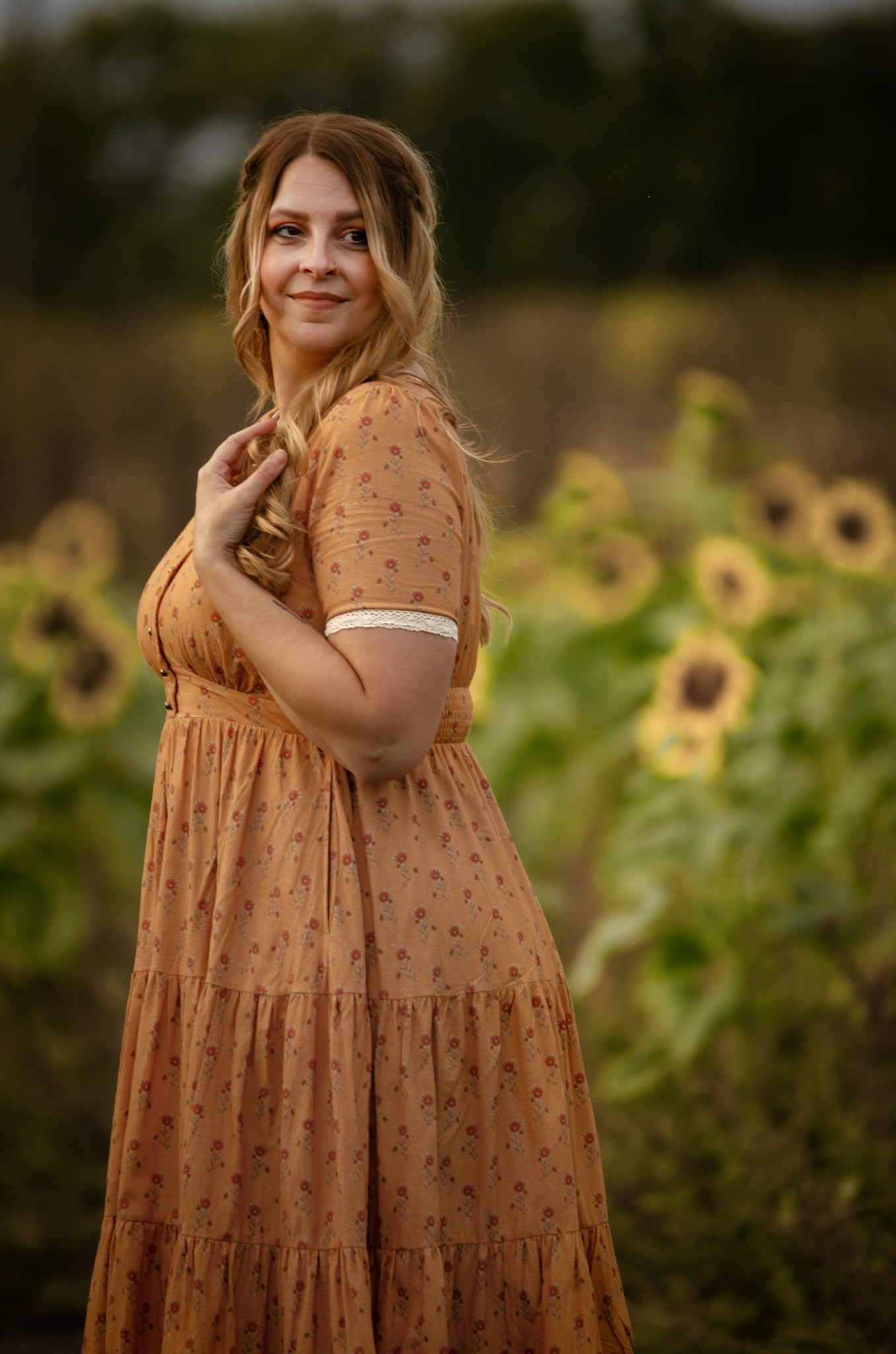 Woman in modest nursing dress sunflower field