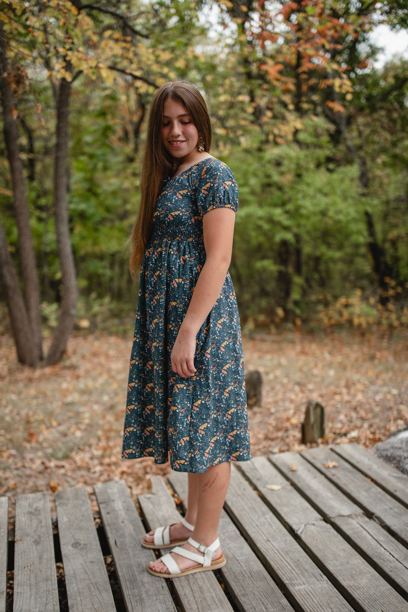 Woman in modest nursing dress outdoors