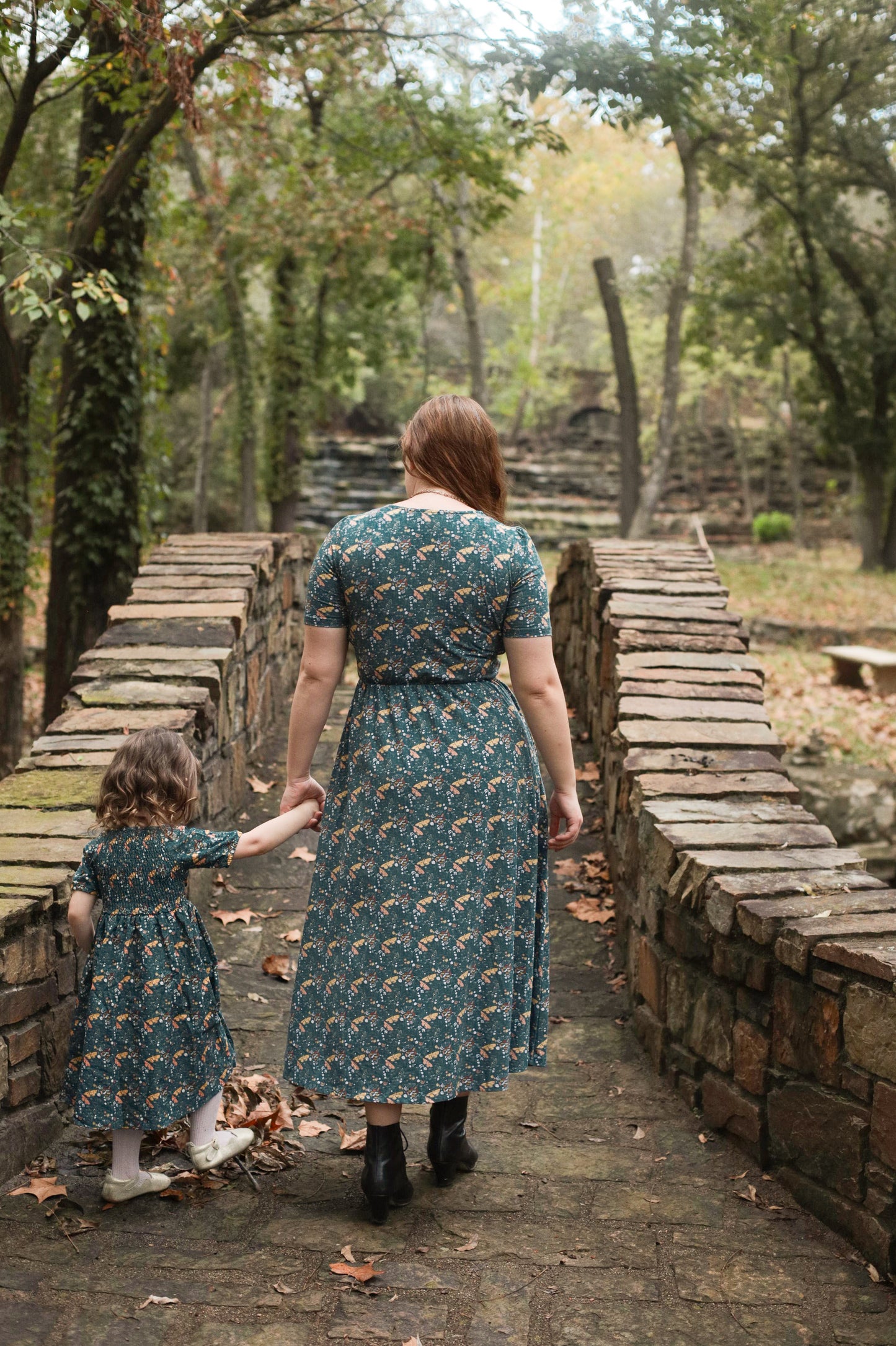 Two women in modest nursing dresses outdoors