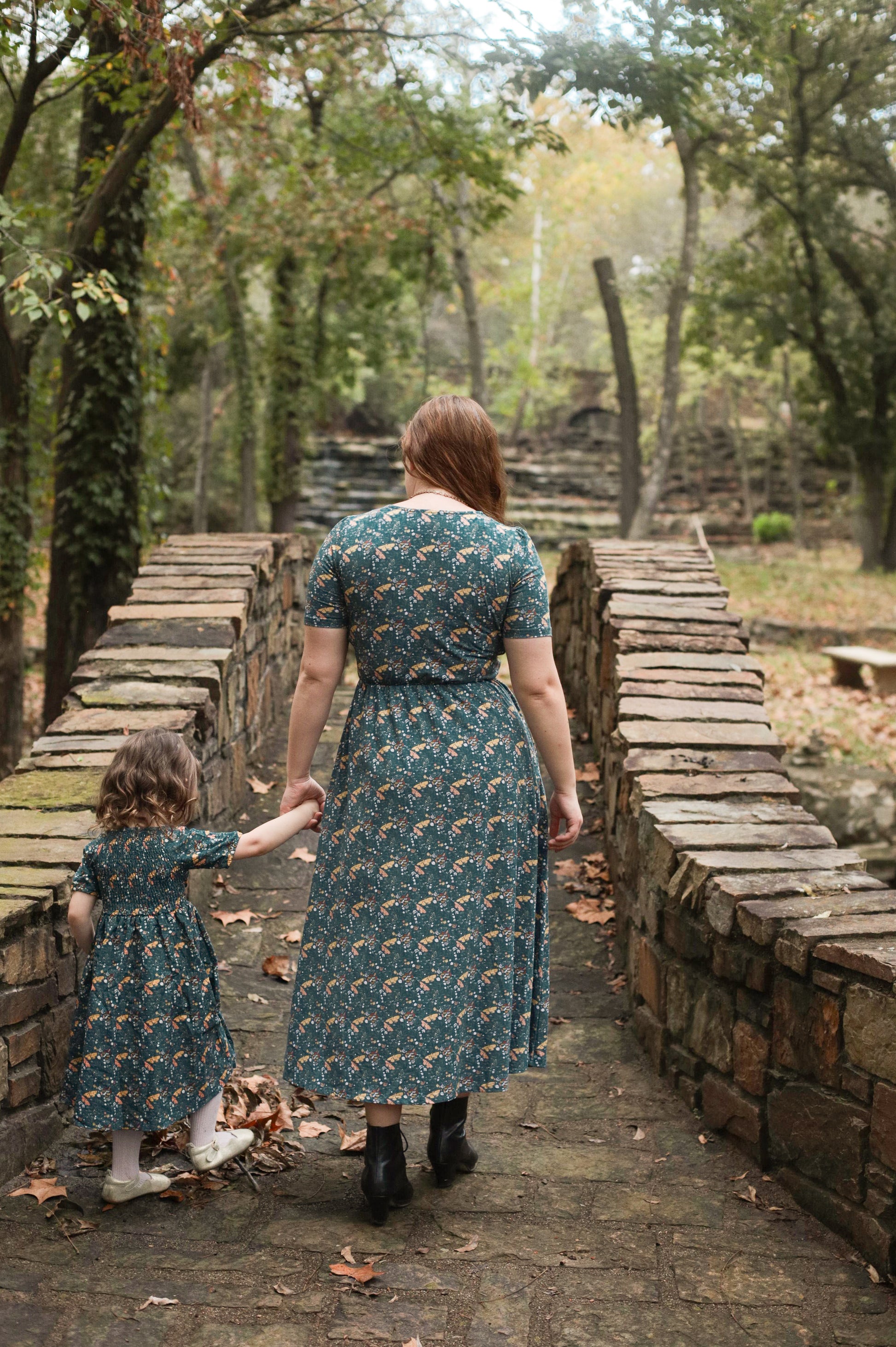 Two women in modest nursing dresses outdoors