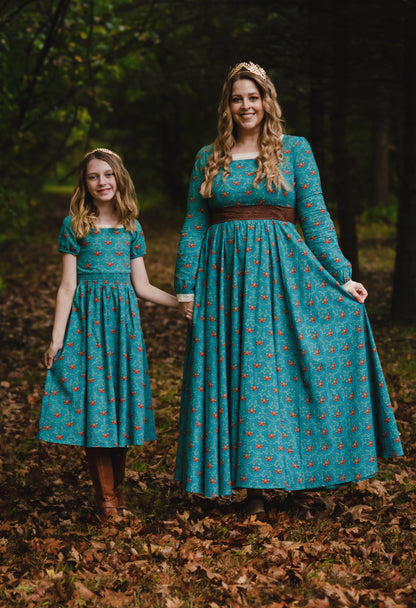 Two women in modest nursing teal floral dresses
