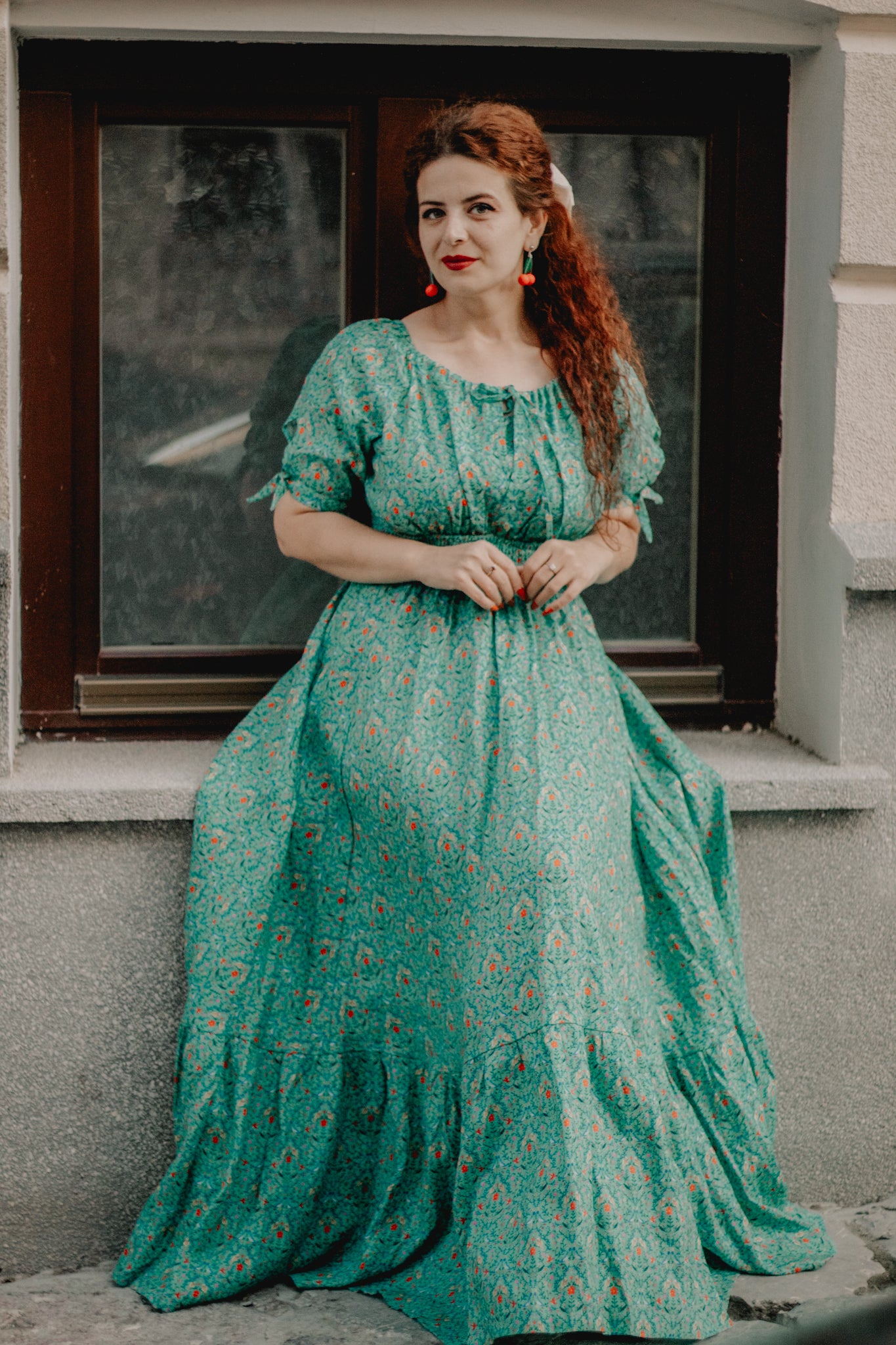 woman wearing a modest nursing green dress