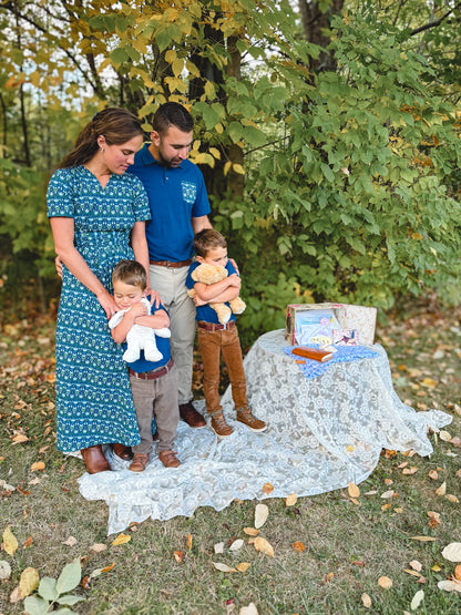 Mother in modest nursing dress at baby shower with family