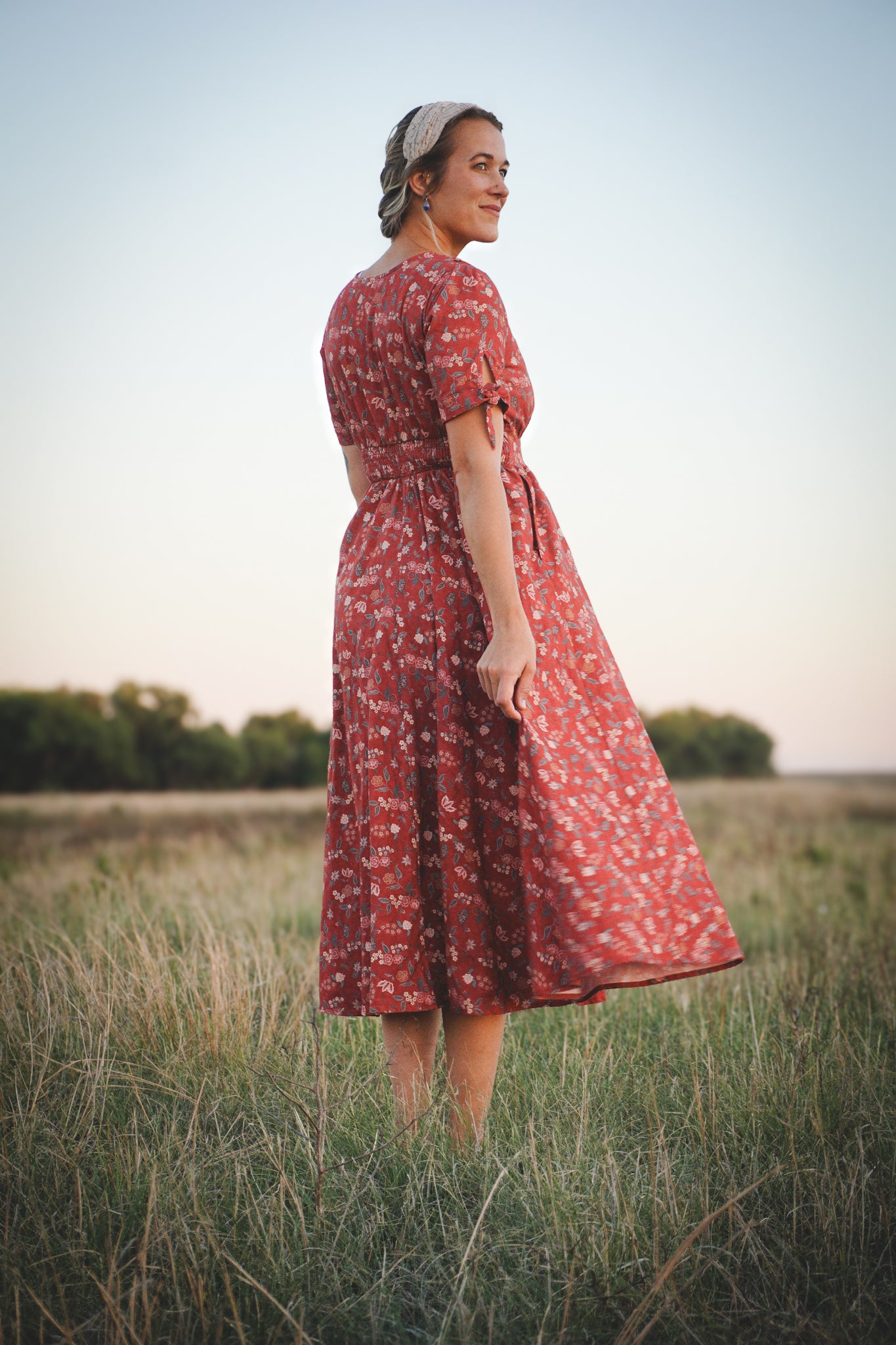 Woman in modest nursing red floral dress outdoors