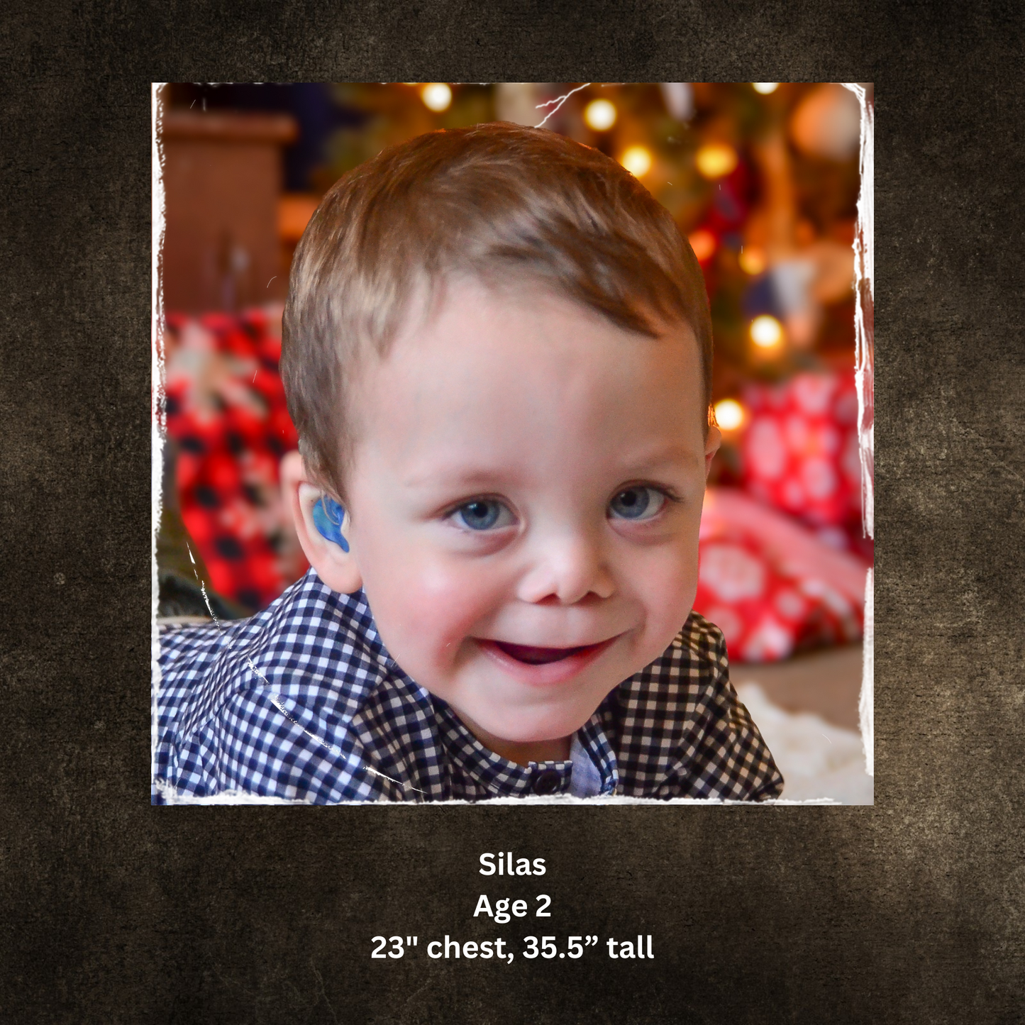 Child smiling in checkered shirt