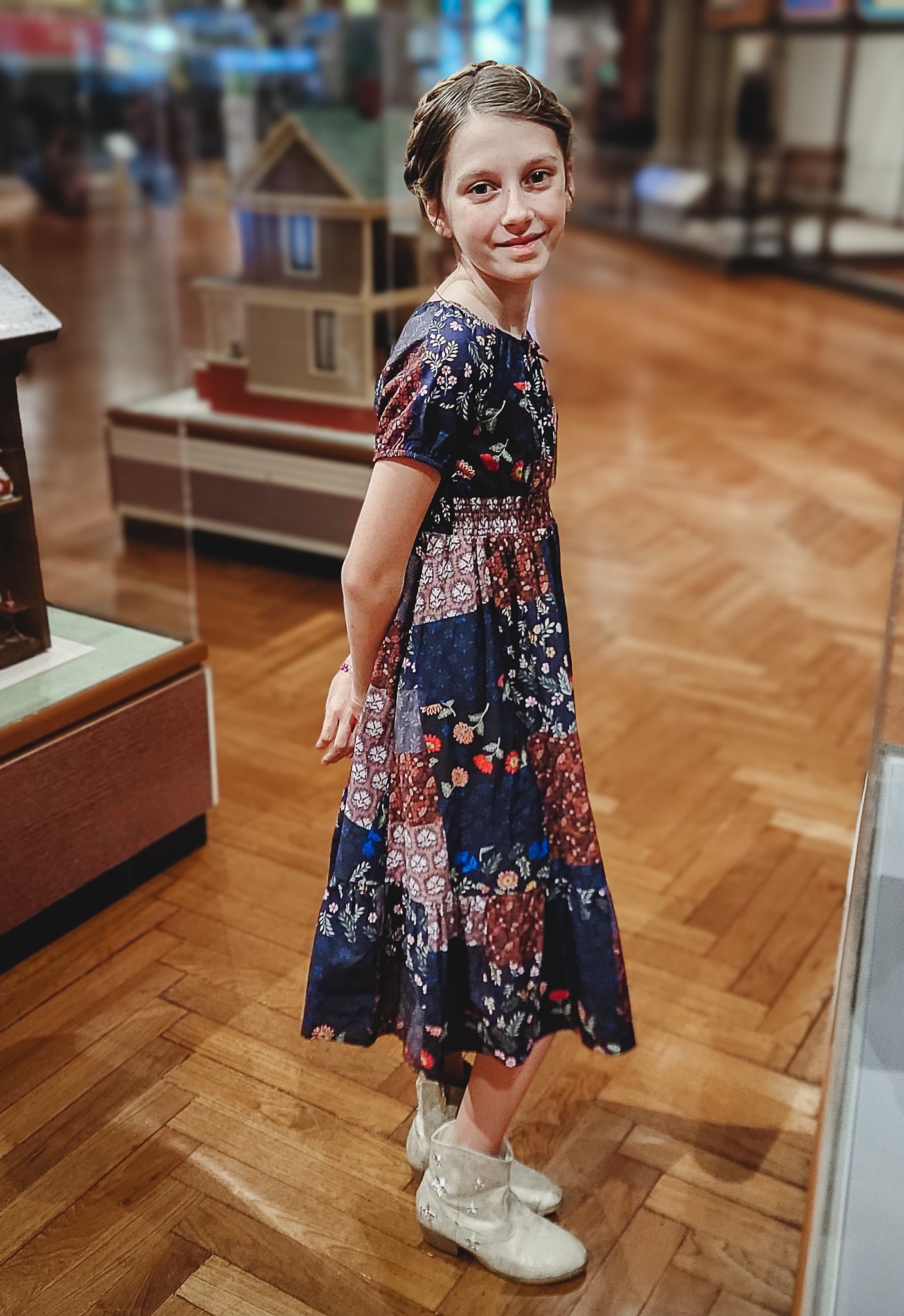 young girl wearing a cute patchwork dress