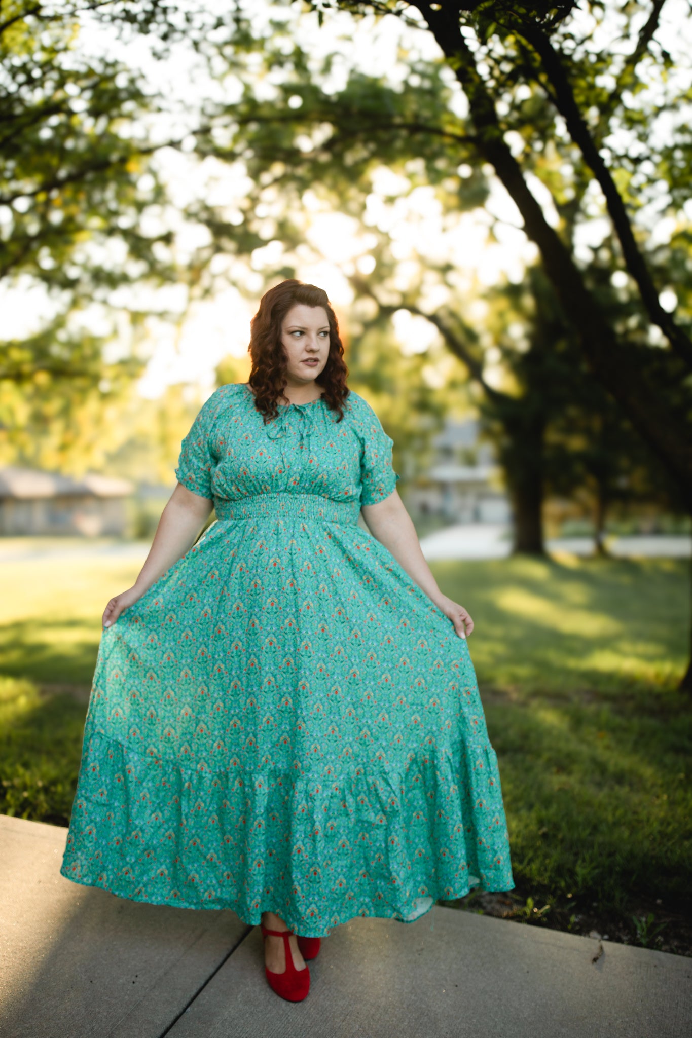 Woman in modest nursing teal dress outdoors
