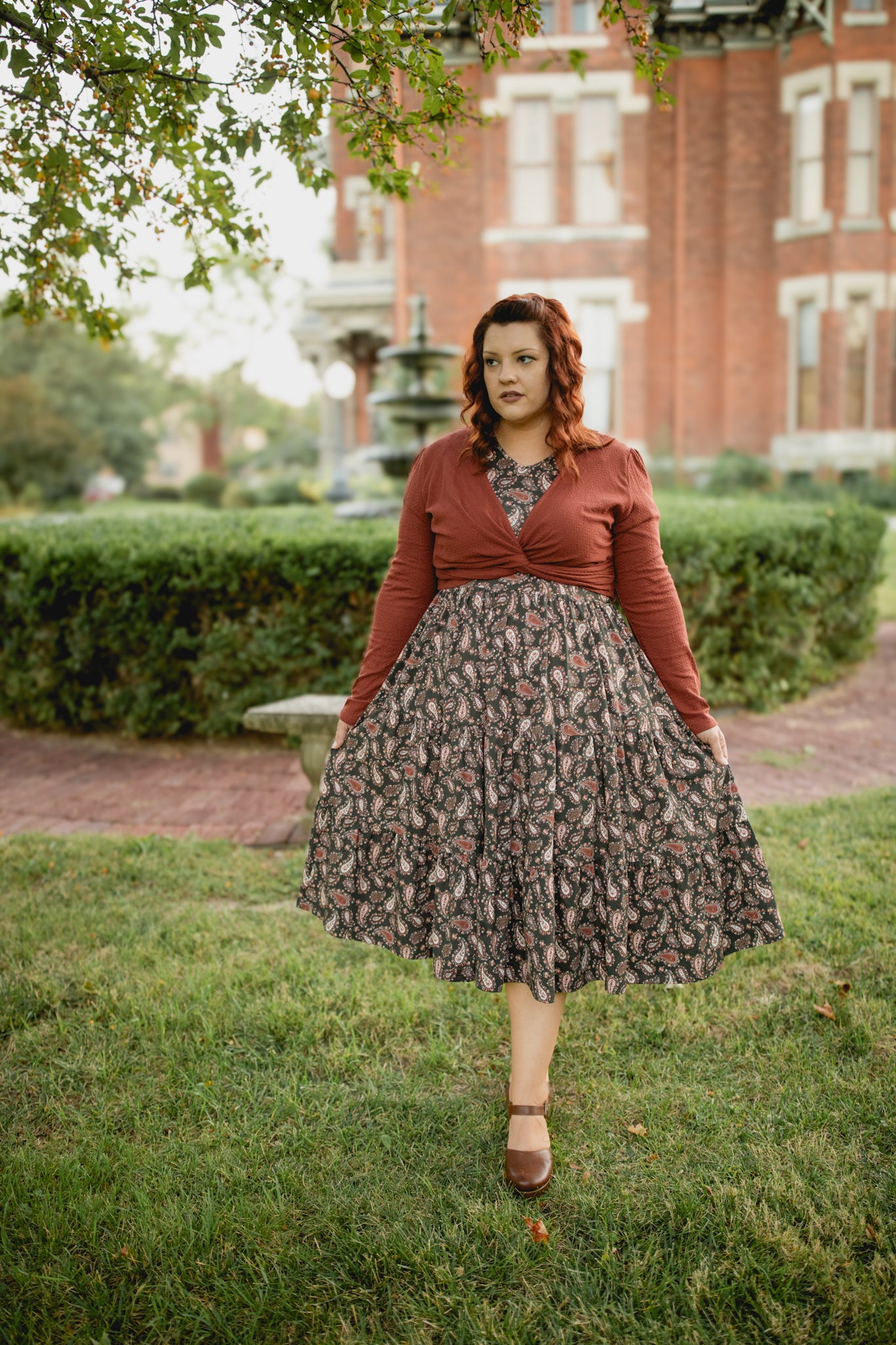 Woman in modest nursing floral dress with cardigan