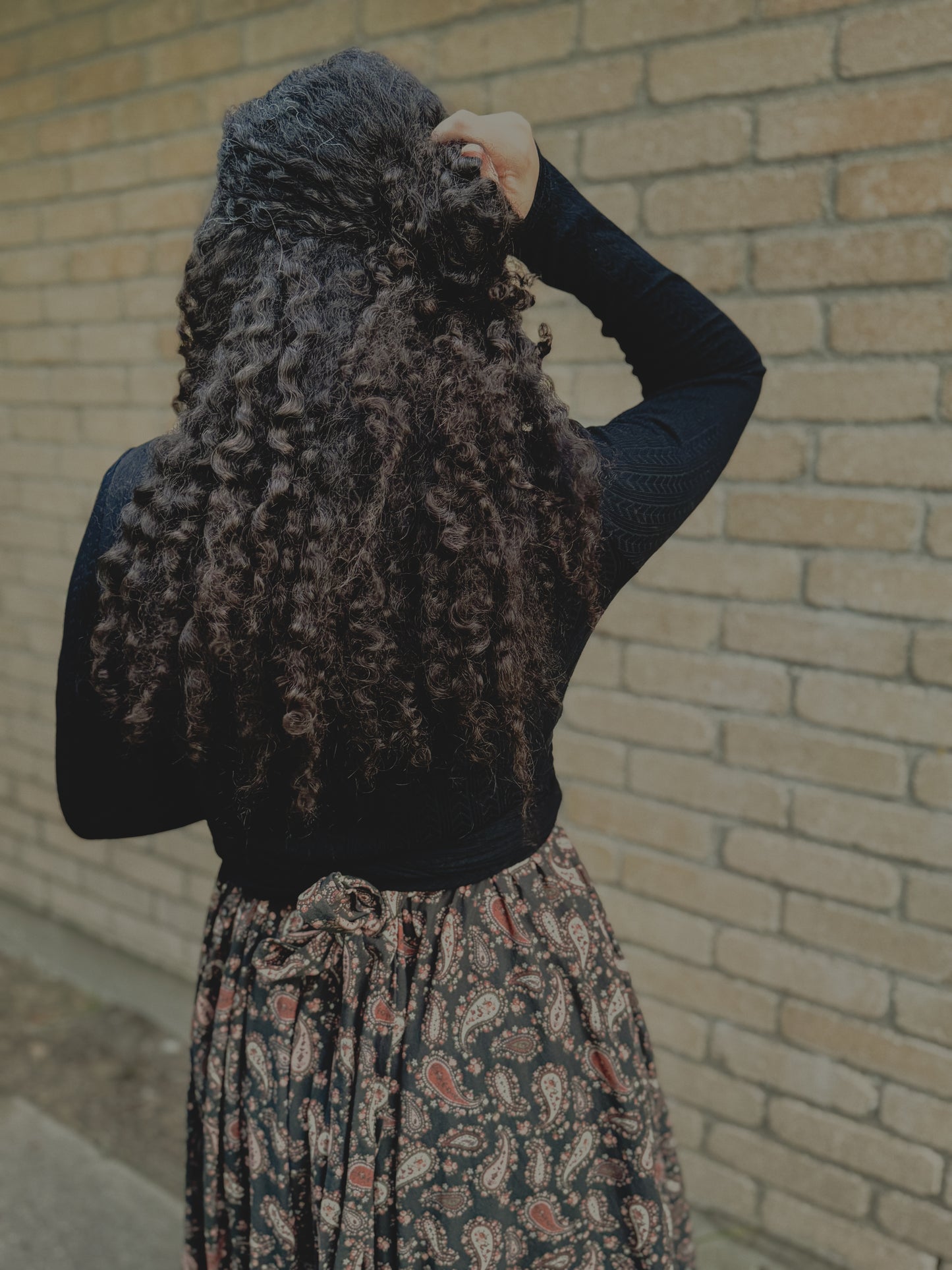 woman wearing a modest nursing black patterned dress