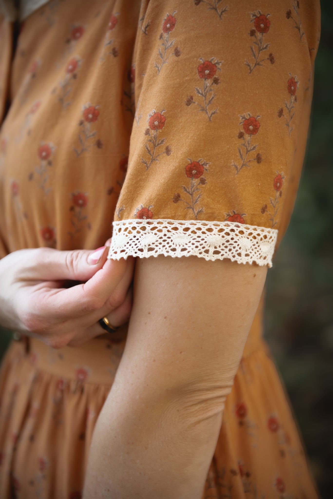 Close-up modest nursing dress with lace trim
