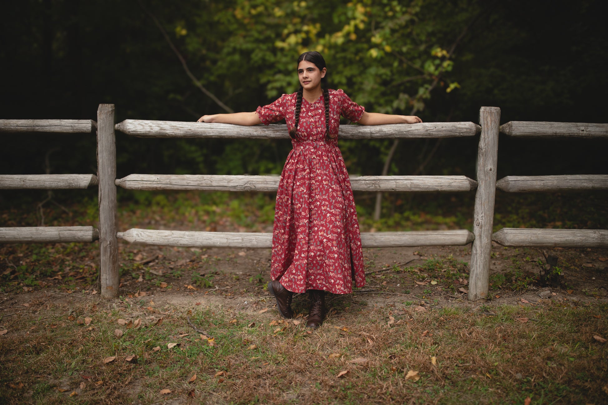 Woman in modest nursing red floral dress outdoors