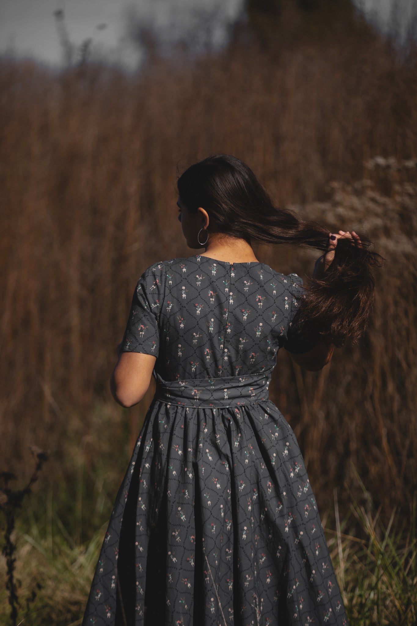 Modest nursing-friendly dark dress back view field