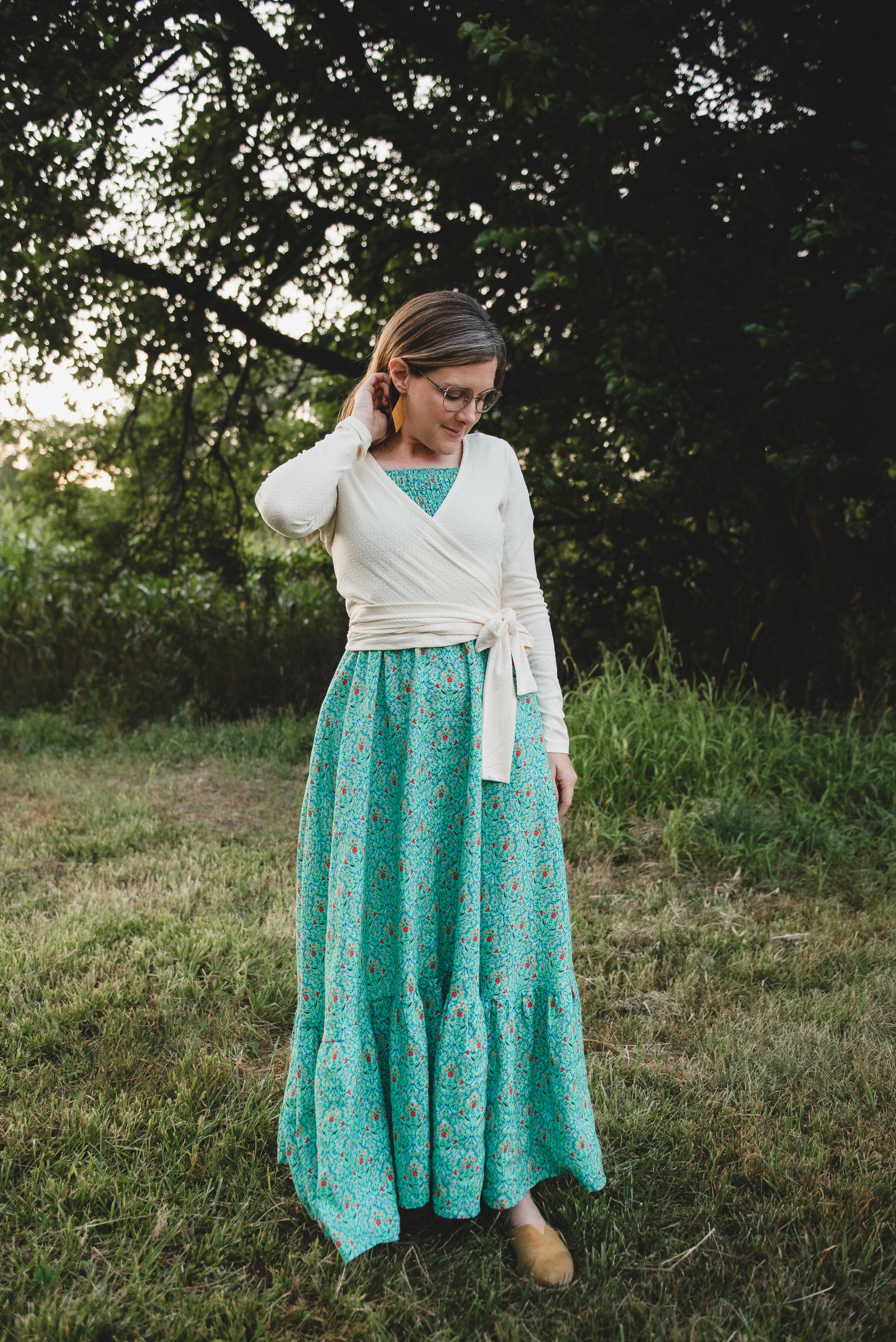 Woman in modest nursing teal floral skirt