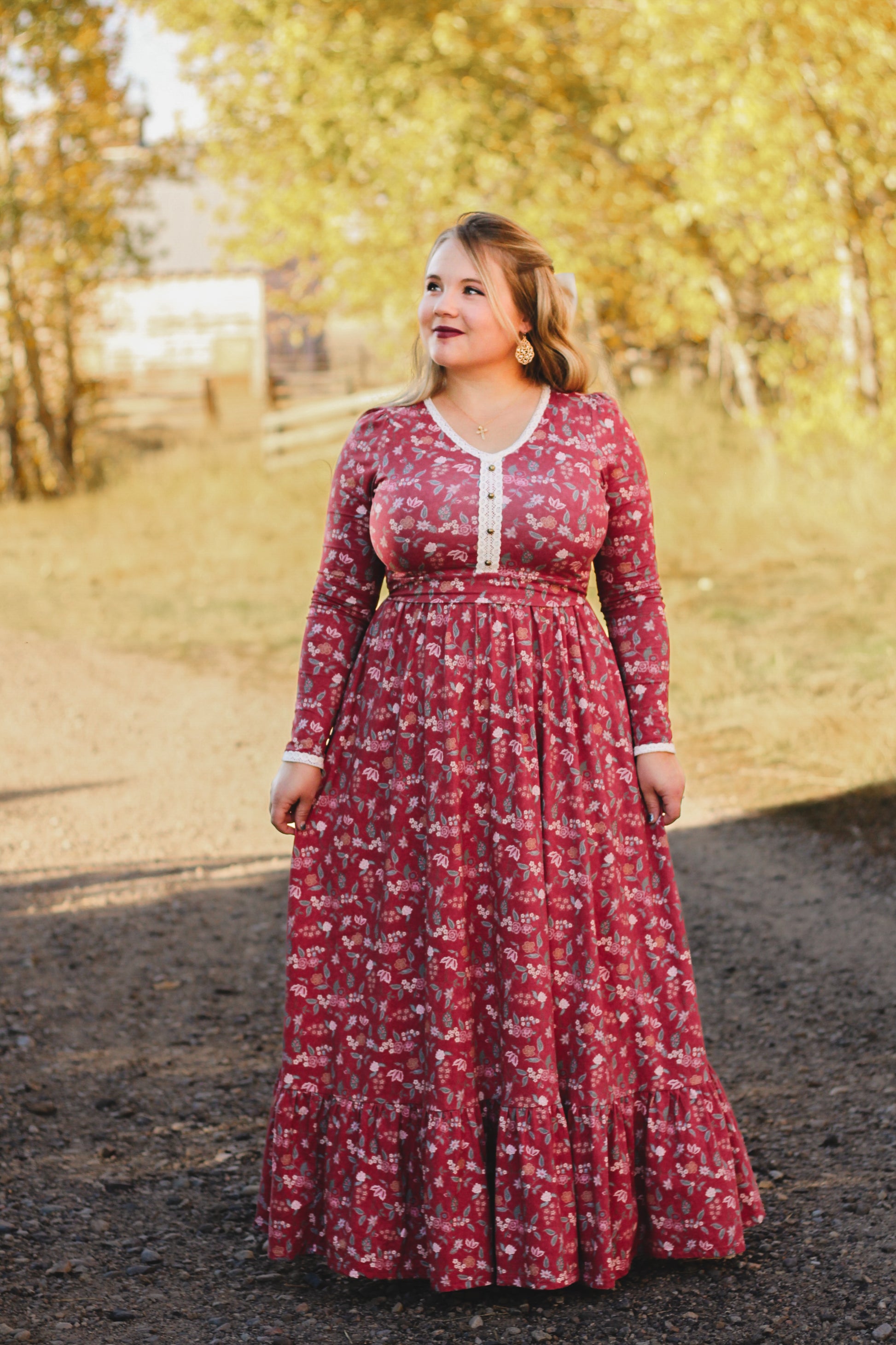 Woman in modest nursing red floral dress outdoors