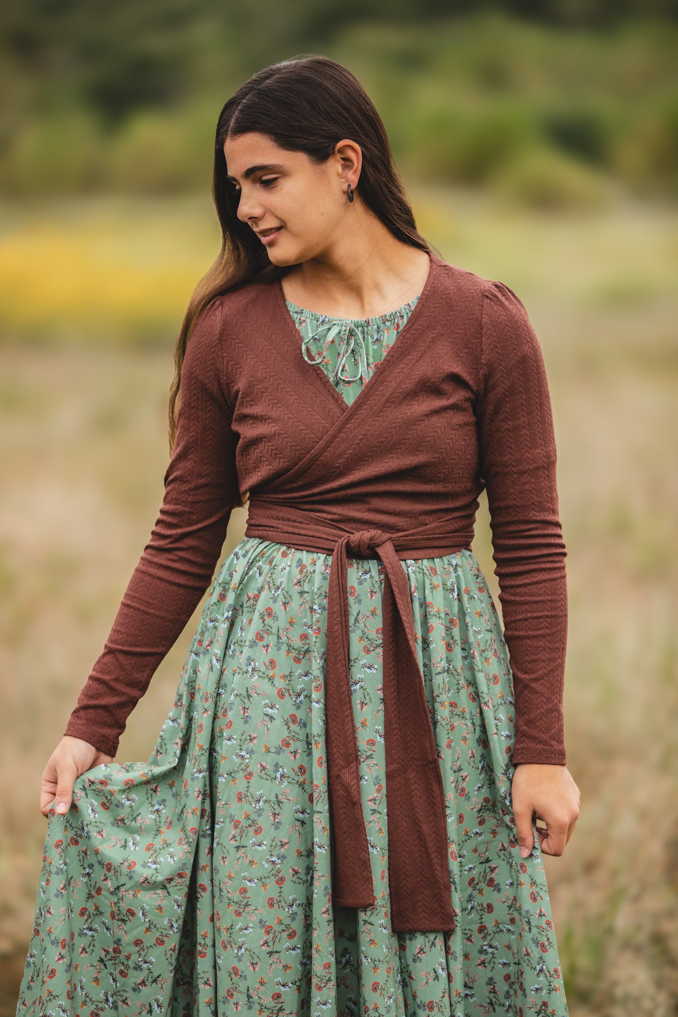 Woman in modest nursing outfit in natural setting