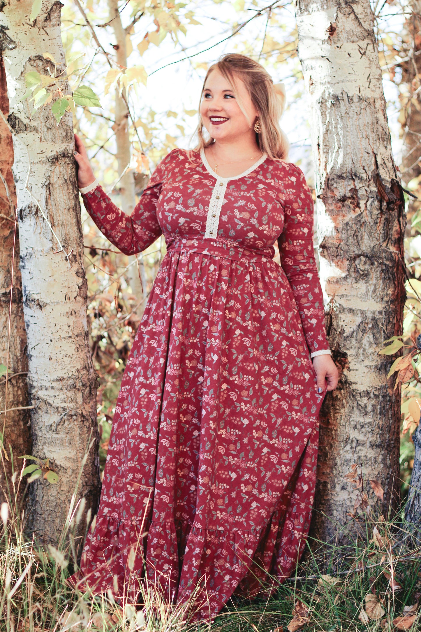 Woman in modest nursing red floral dress outdoors
