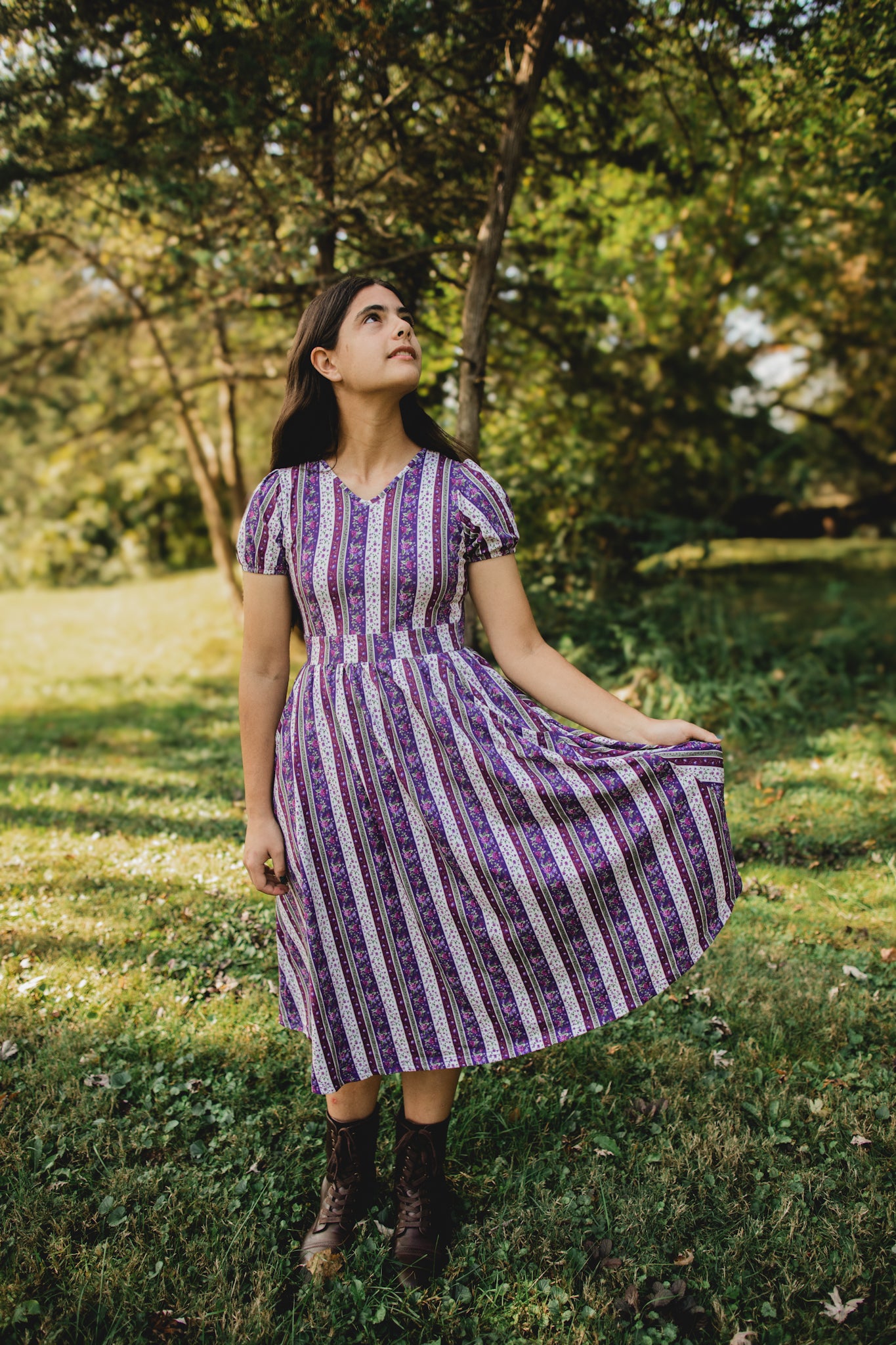woman wearing a modest nursing purple and white striped dress