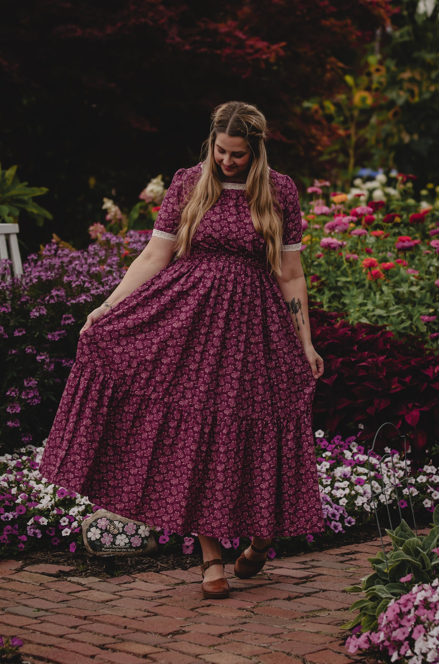 Woman in modest purple floral nursing dress outdoors